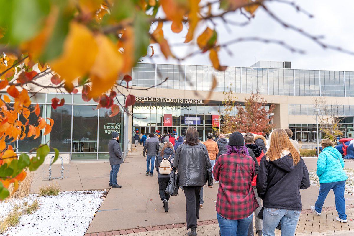 picutre of campus amongst the fall leaves with snow on the ground